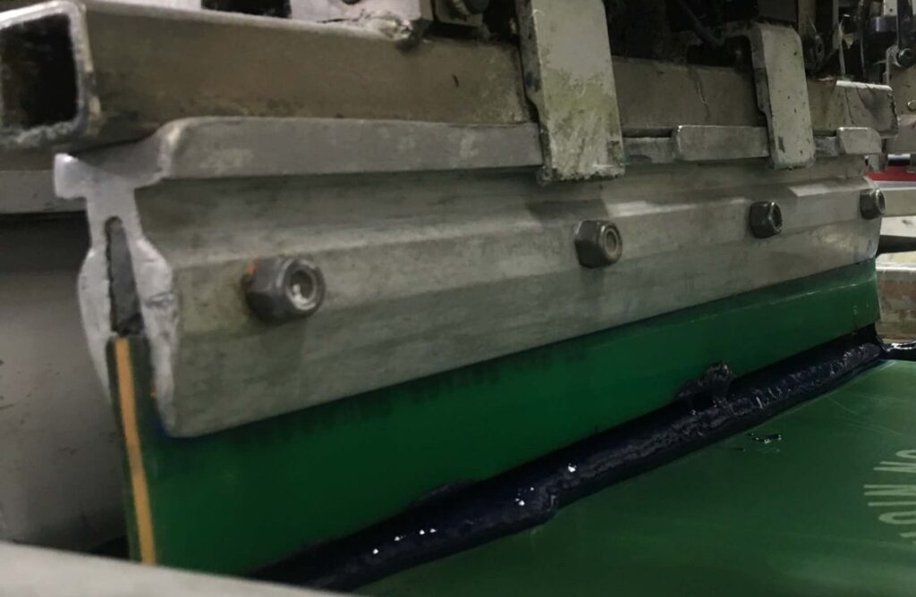 screen printing with a squeegee